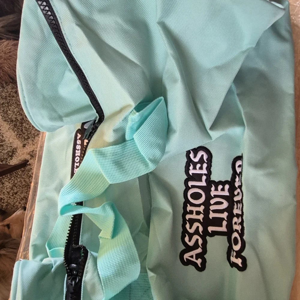 Aqua Garment Bag with 'Assholes Live Forever' Embroidery